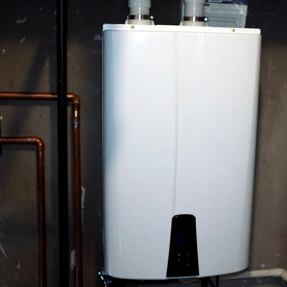 Energy-efficient tankless water heater mounted on a wall