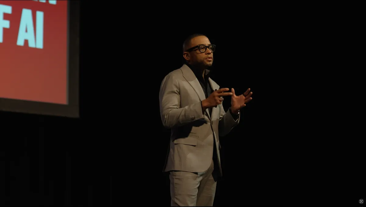 Ethan King delivering a keynote on stage
