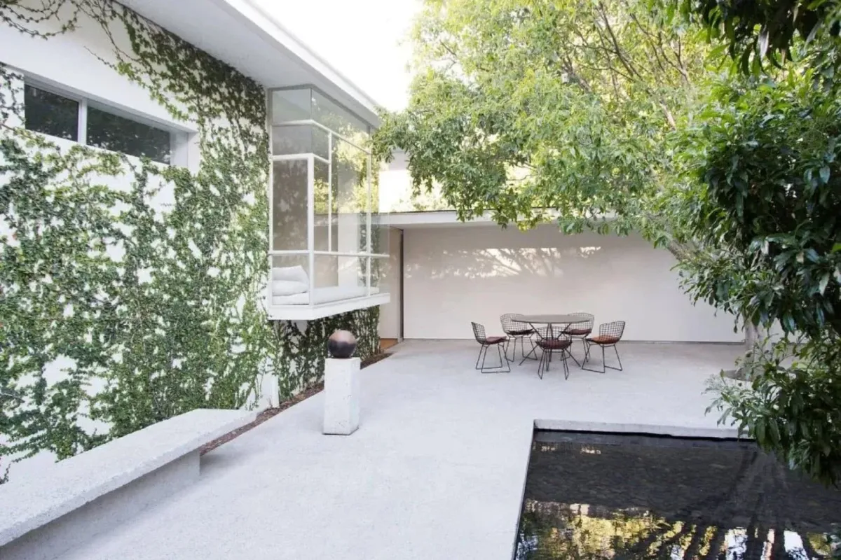Backyard pool with premium artificial turf surround and lounge seating
