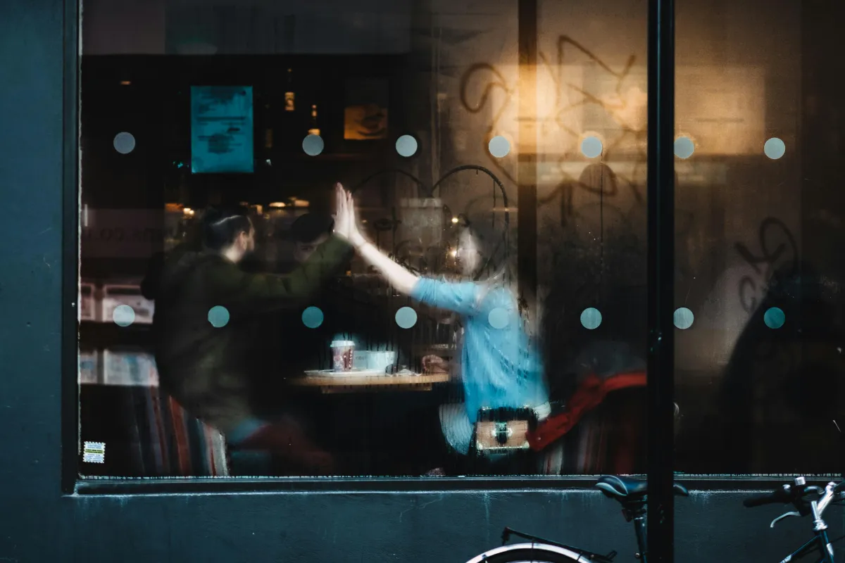 two person reaching each others hand