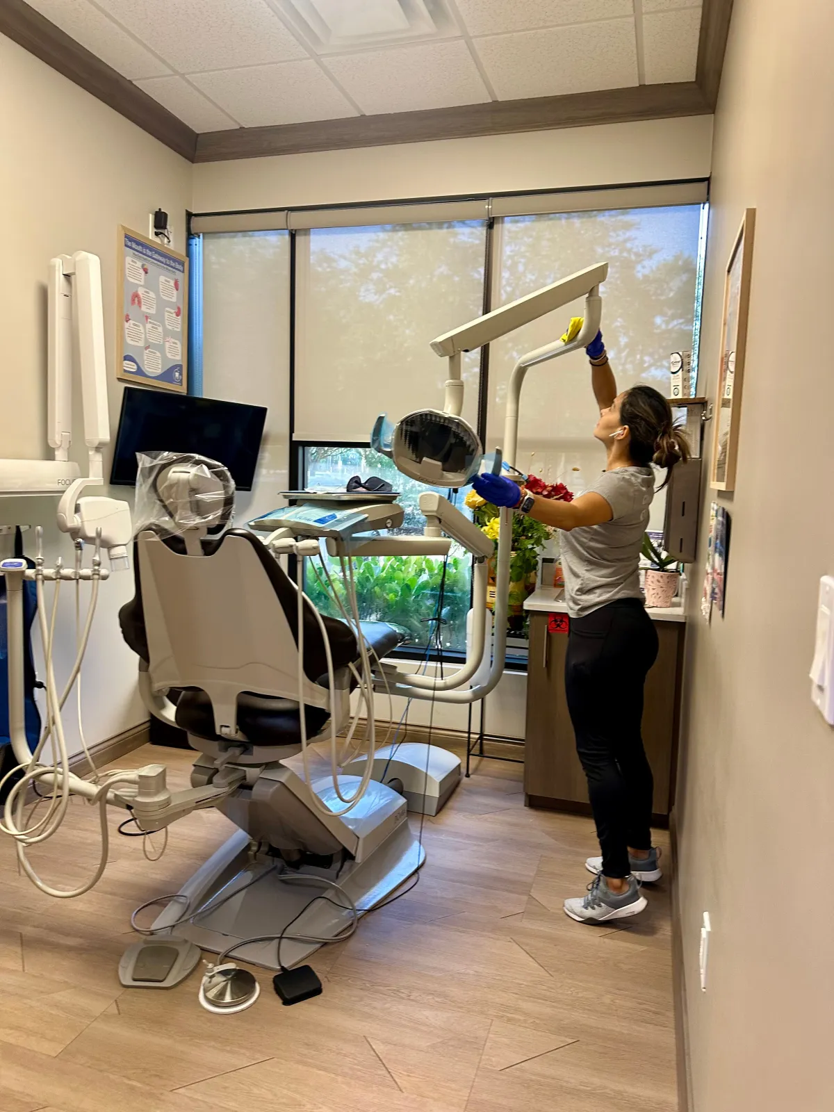 Puroshine staff disinfecting dental office high-touch areas