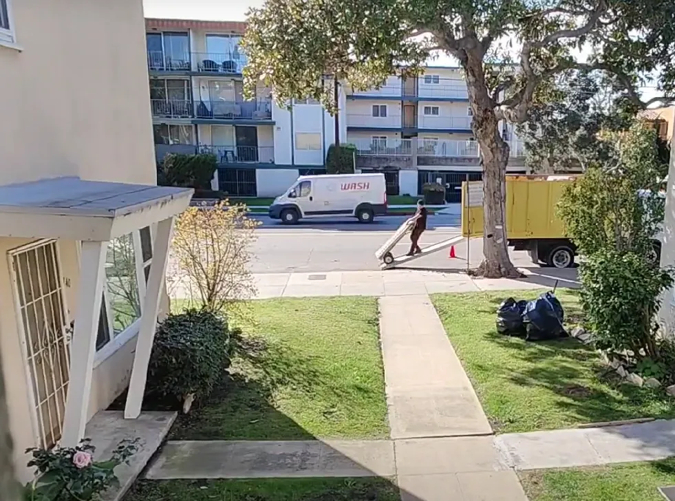 man using a wheelie going down from truck