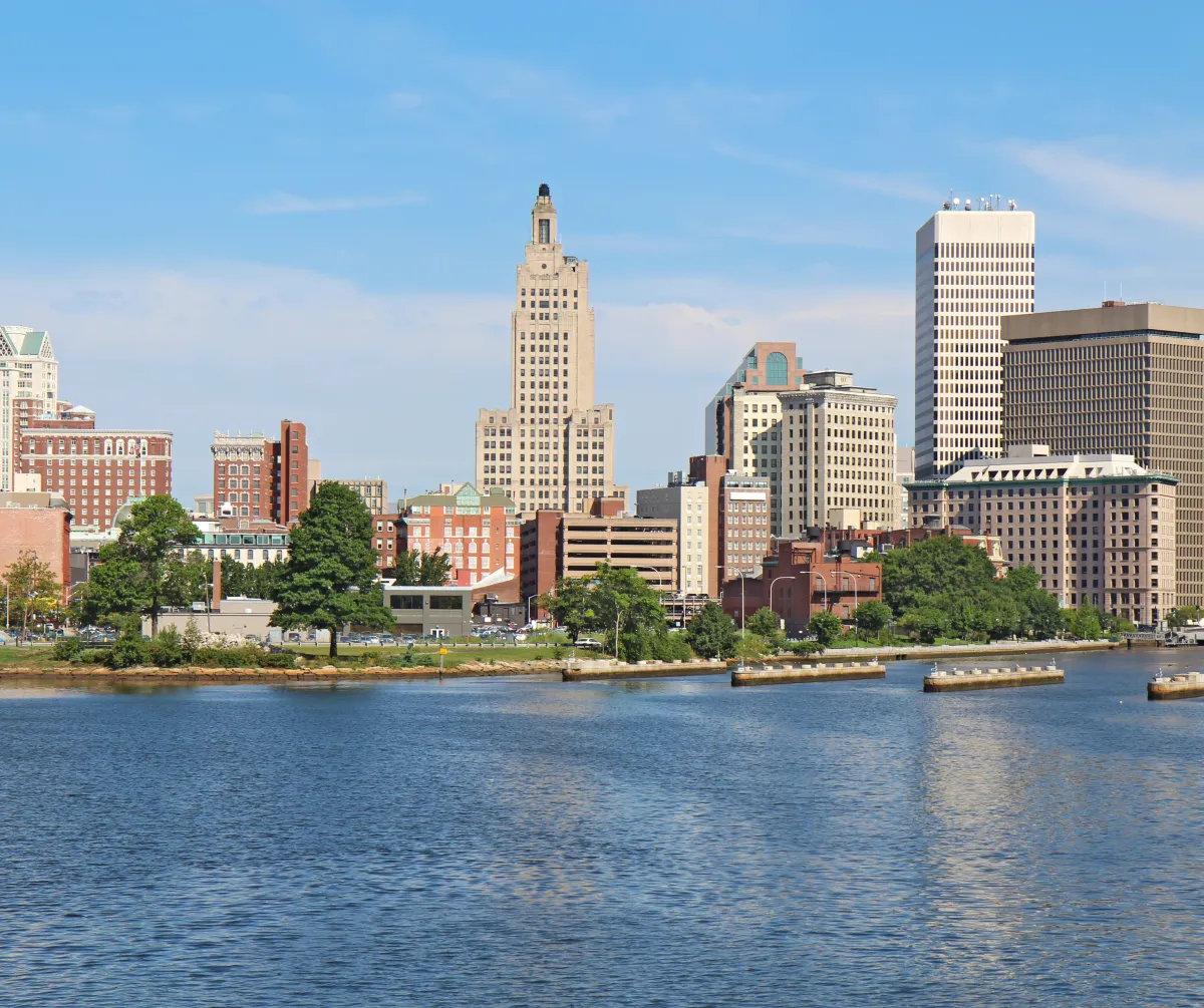 Downtown Providence, Rhode Island skyline viewed across the Woonasquatucket River on a clear day.