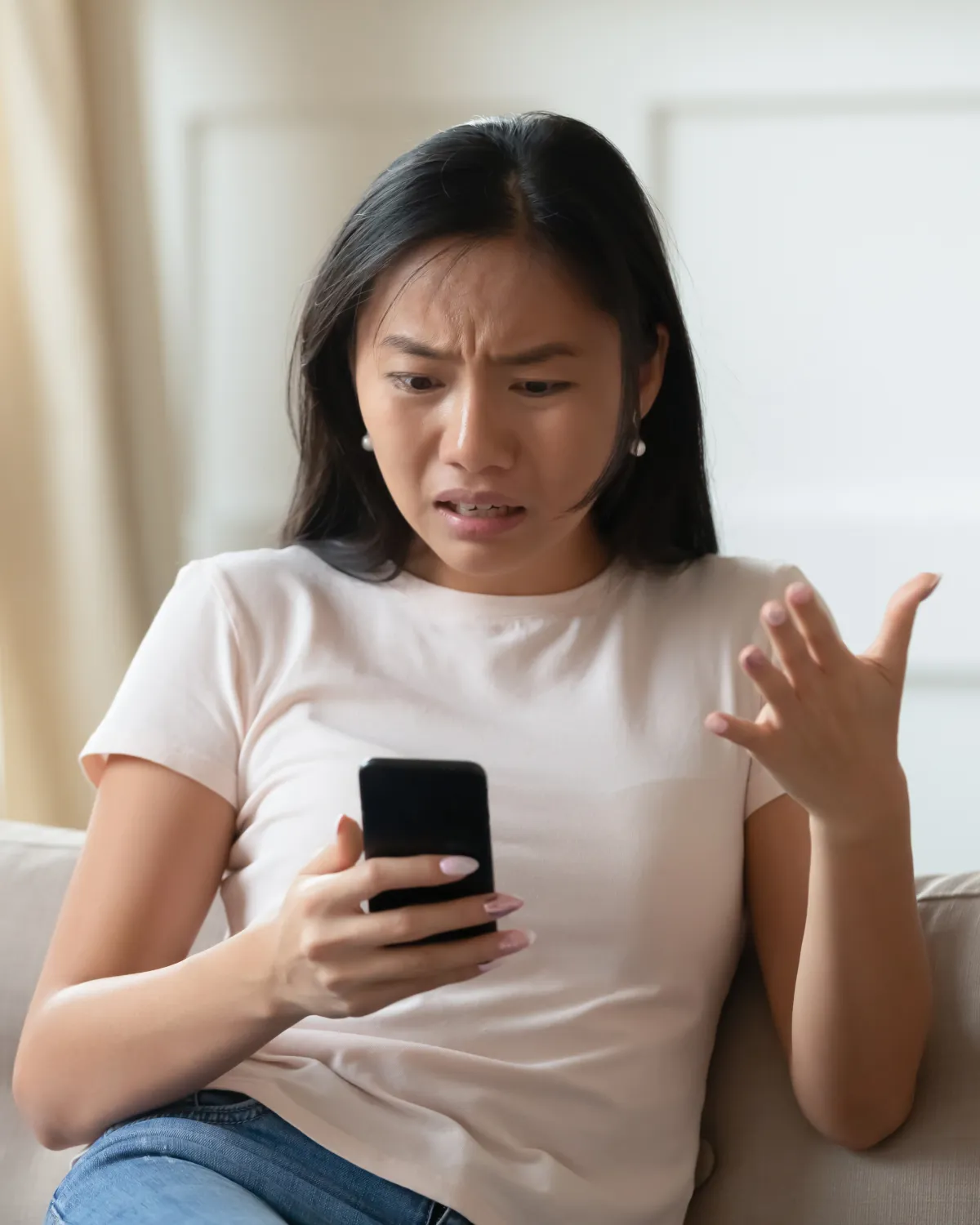 "Frustrated customer waiting for a business text reply, emphasizing the importance of fast responses."