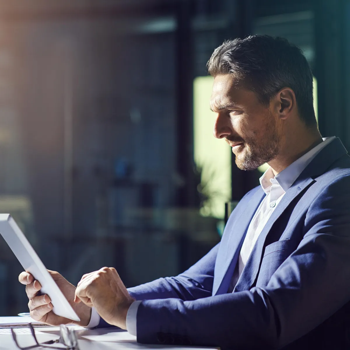 "Small business owner scheduling appointments using Rhode Island AI on a tablet."​