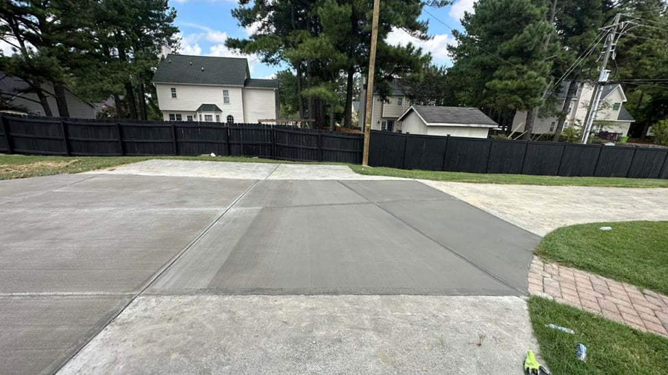 Freshly poured concrete driveway installation  by a concrete contractor in Durham, NC