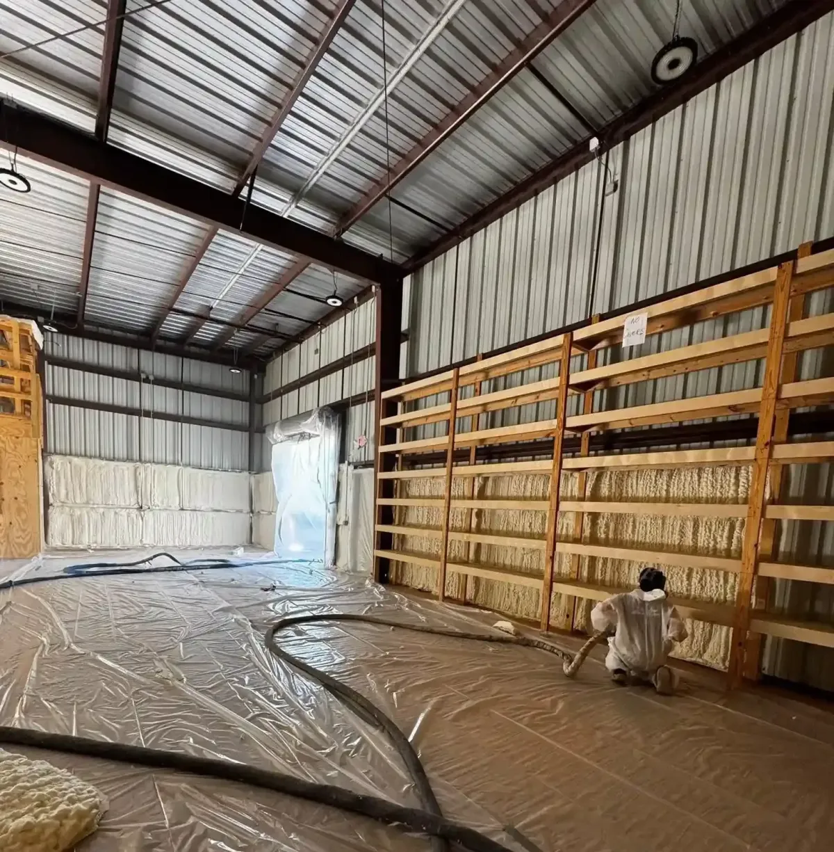 Open-cell spray foam insulation applied to attic walls in Panama City FL by Blue Line Insulation