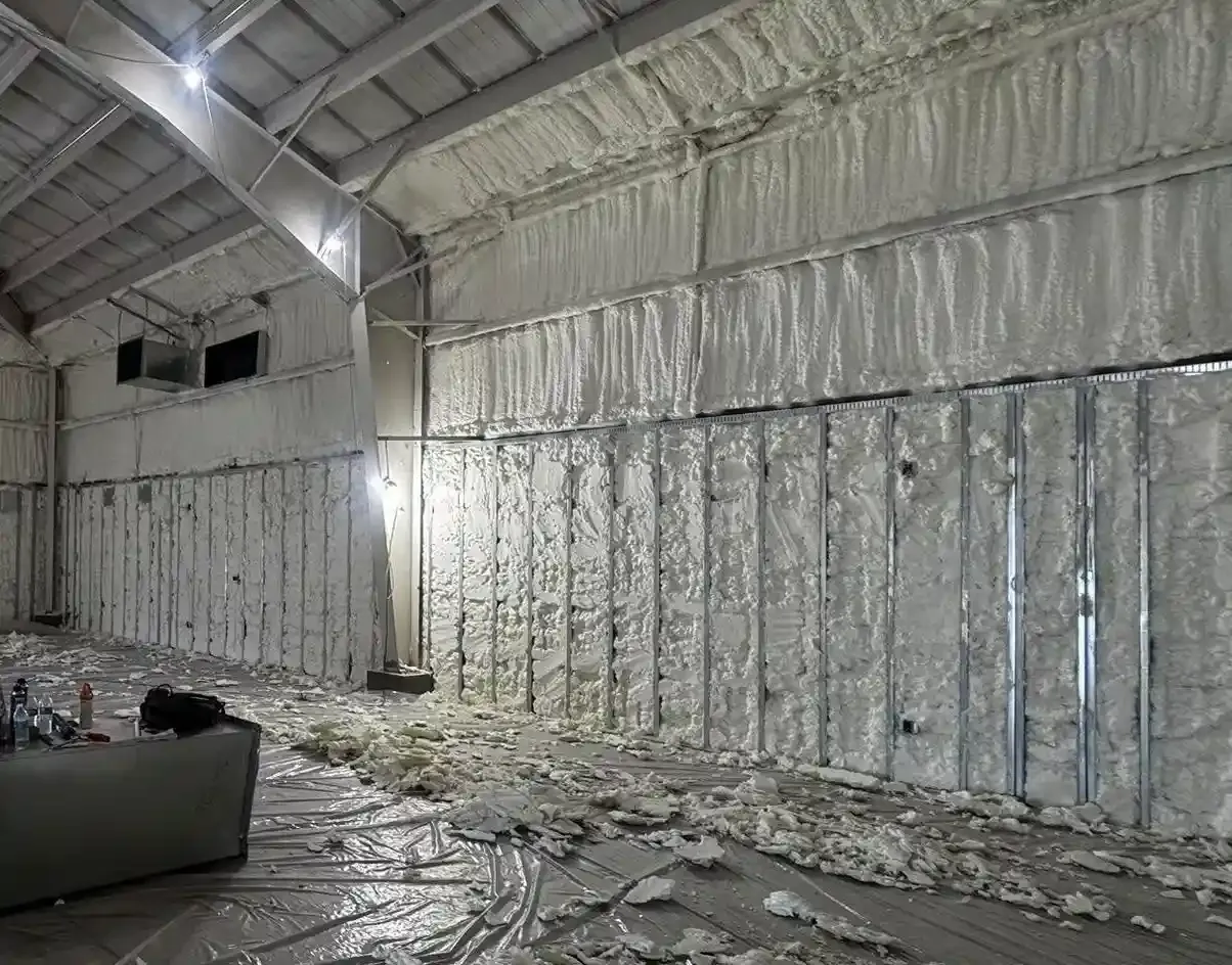 Open-cell spray foam insulation applied to large metal structure in Rosemary FL by Blue Line Insulation