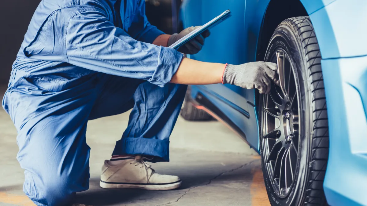Photo of a Ford staff member inspecting a pre owned vehicle