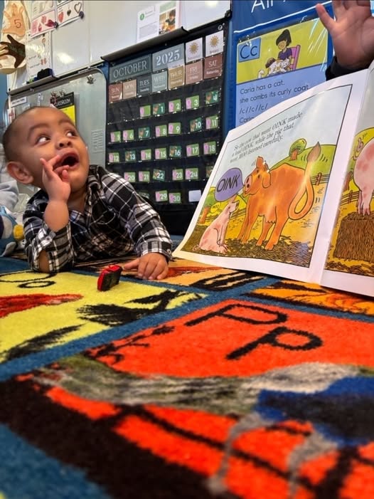 Boy picks paper out of different colored liquids