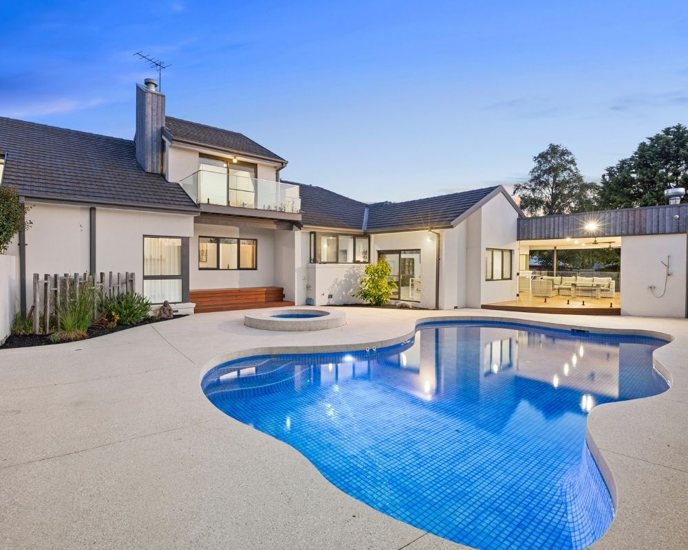 Backyard swimming pool and alfresco area completed during a family home extension