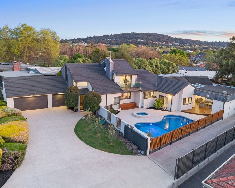 Family home extension with landscaped backyard