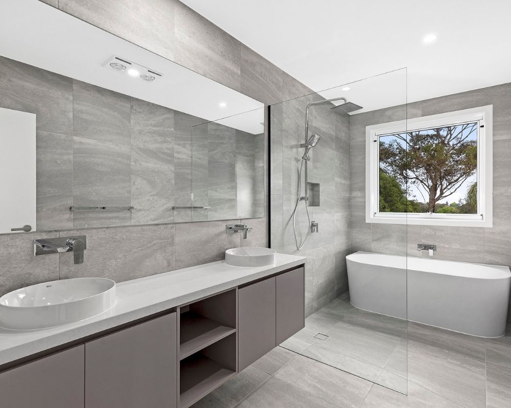 Modern family bathroom renovation with double vanity, freestanding bath and walk-in shower