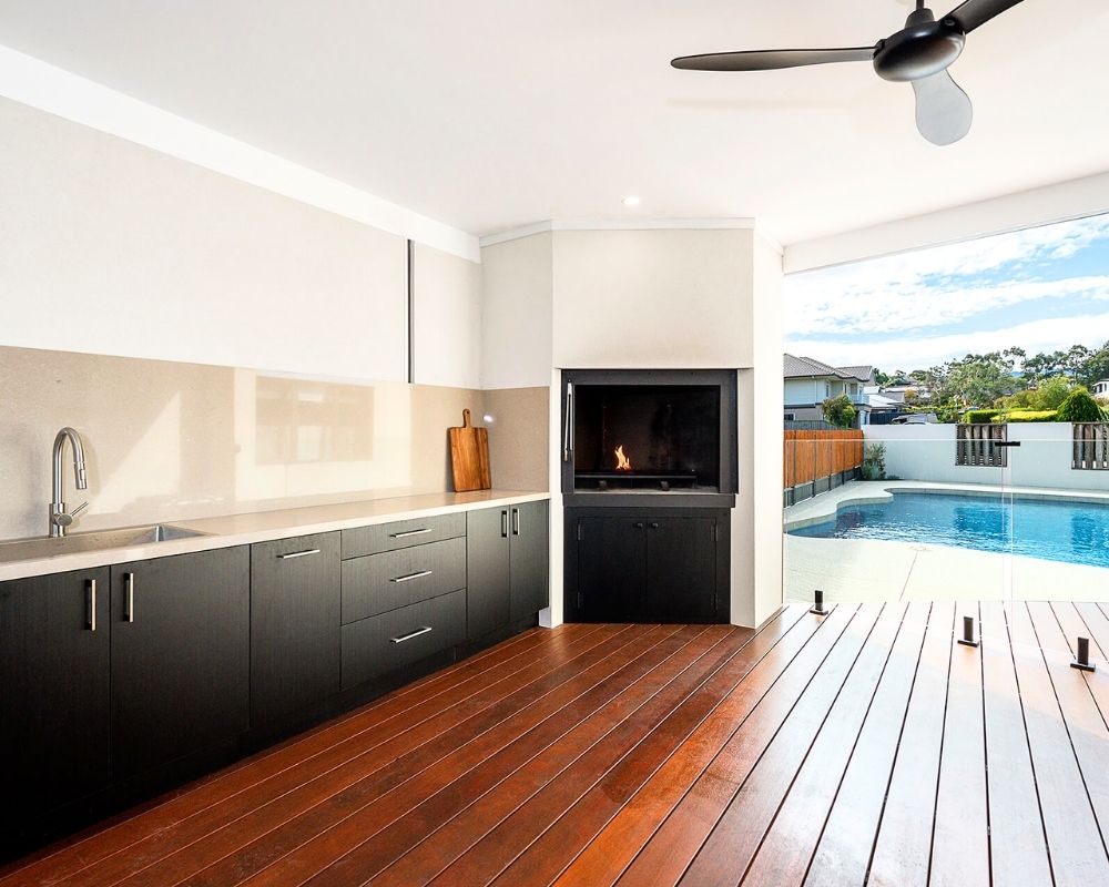 Covered alfresco entertaining area overlooking the swimming pool after a Buderim home extension