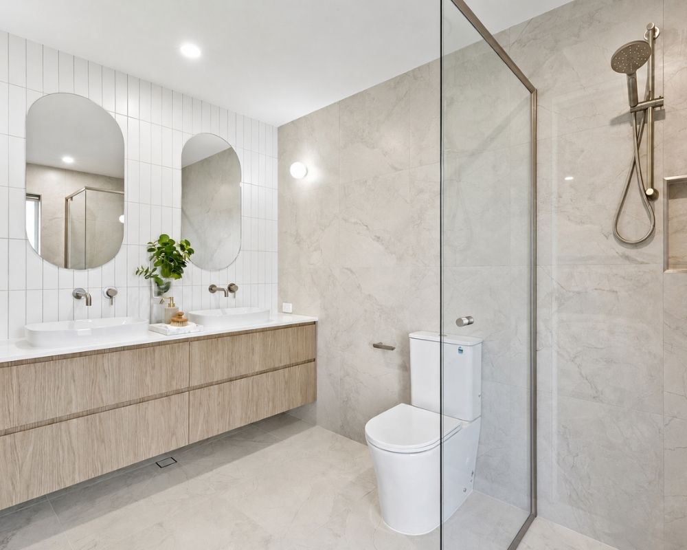 Modern ensuite with double vanity and walk-in shower completed during a Buderim home extension