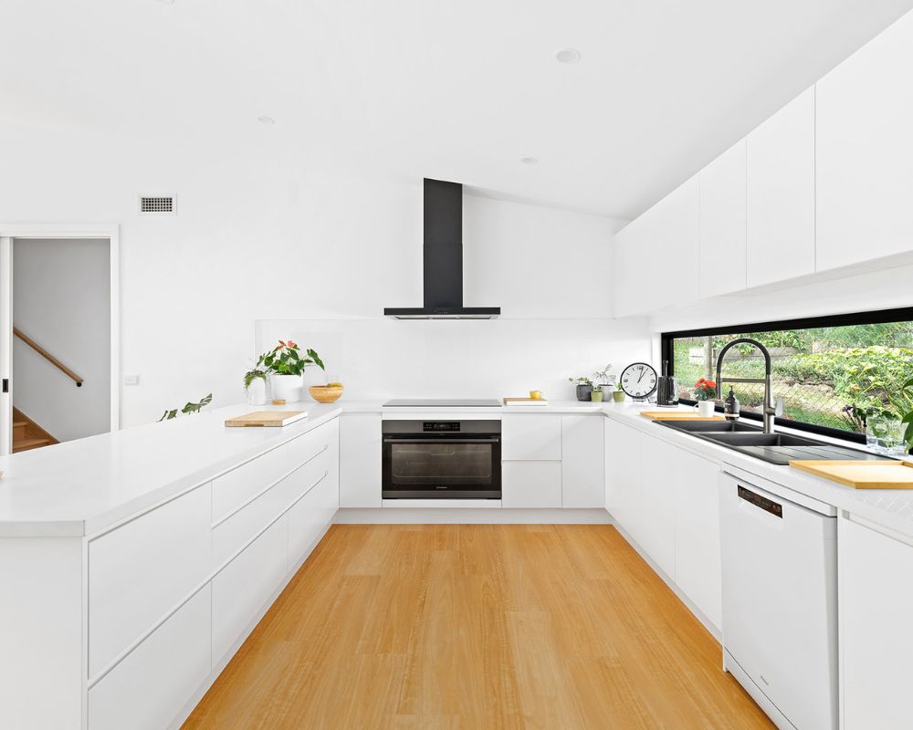 Renovated open-plan living area with polished flooring and improved natural light