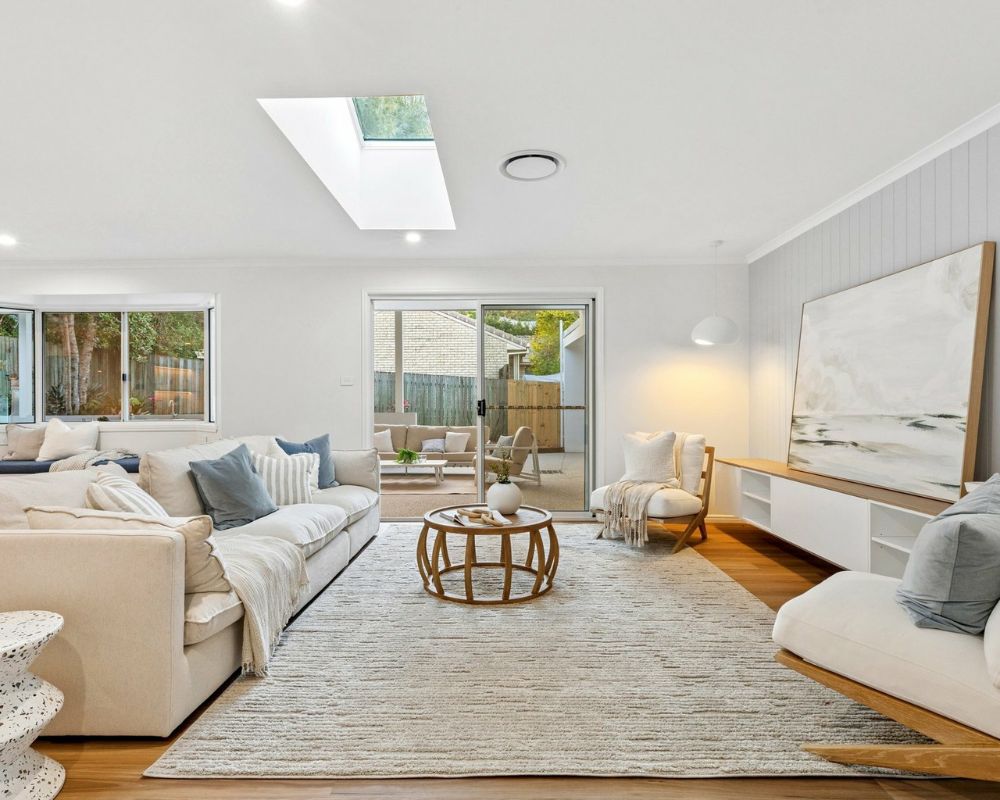Light-filled open-plan living room created by opening up existing rooms