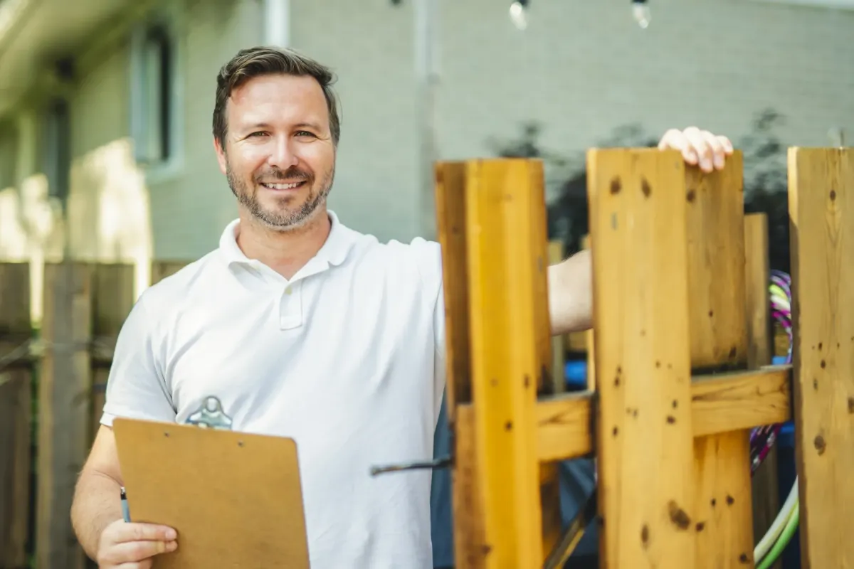 Smiling construction worker, representing ParkerBuilt Construction’s fully licensed and insured services.