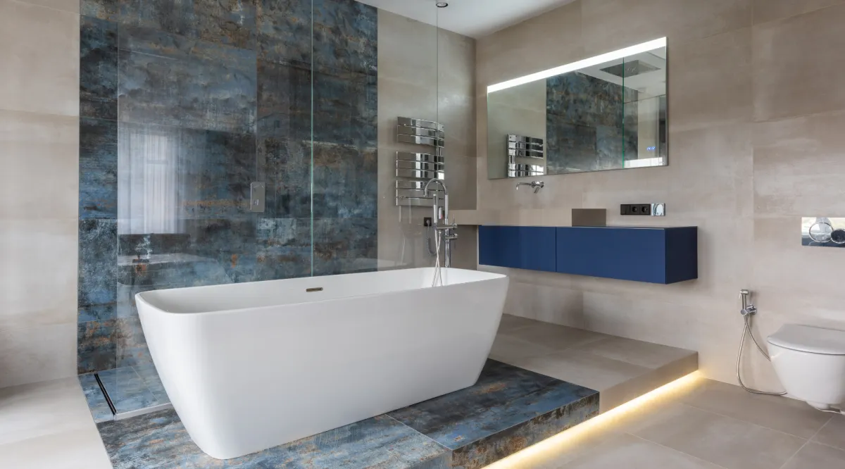 Bathroom remodel with white vanity, modern fixtures, and walk in shower by Dream Design Building Group Jacksonville