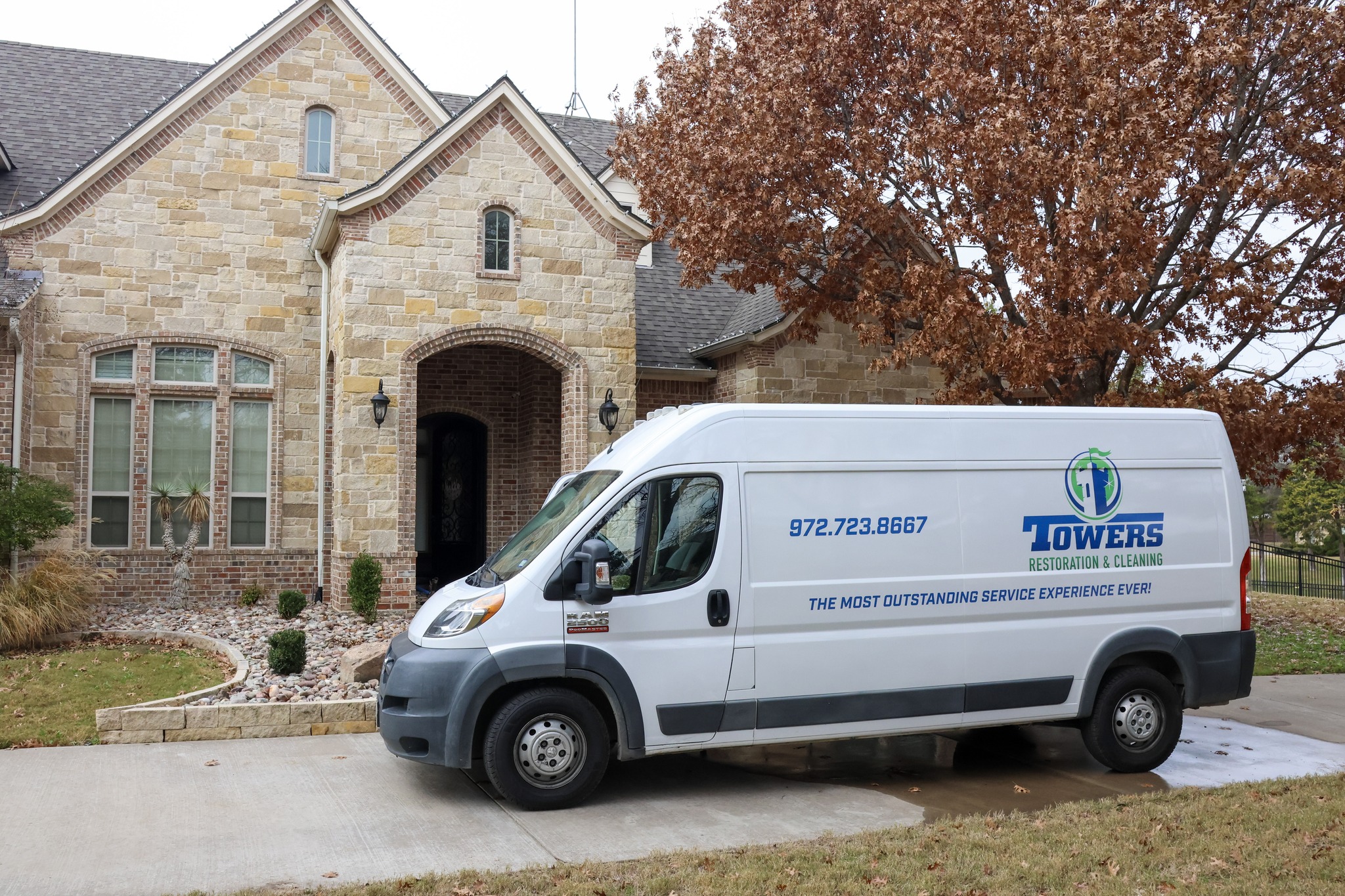 Tower's service van outside a home