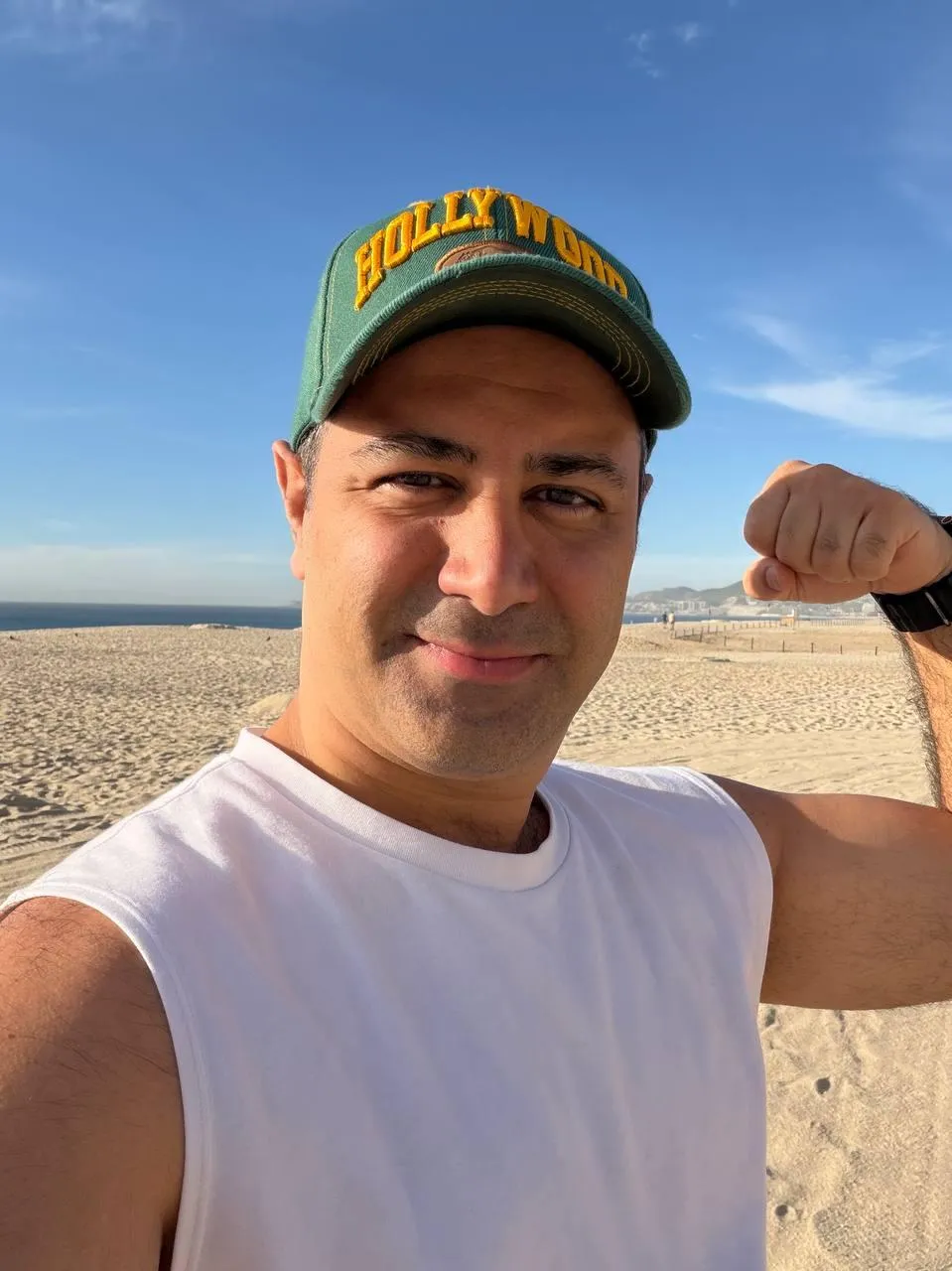 grayscale photo of 3 women sitting on wooden bench