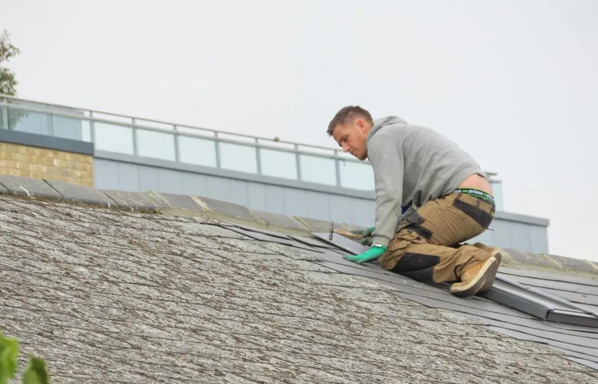 Image of a worker, doing roof maintenance