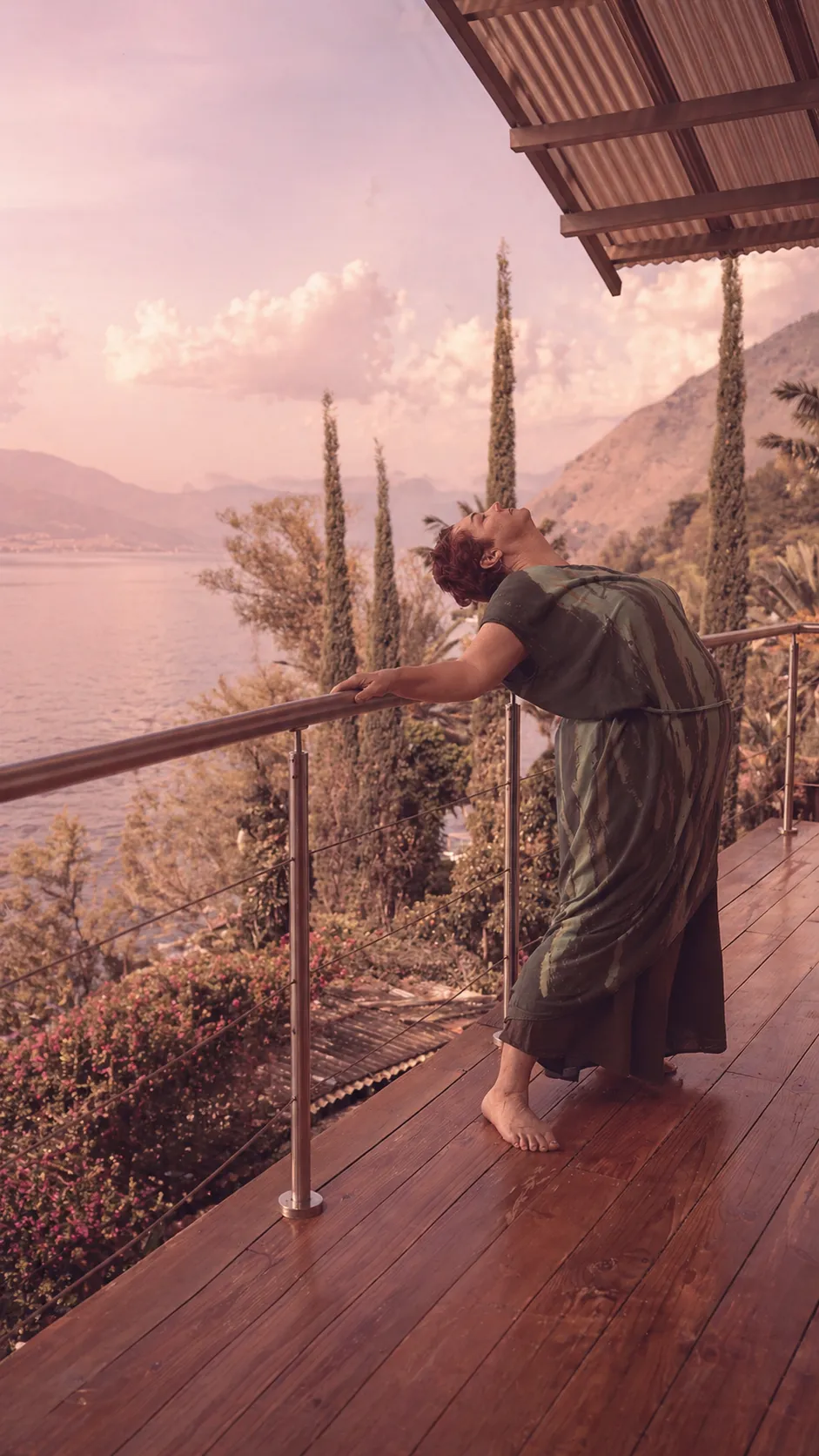 Val practicing somatic bodywork on a peaceful lakeside balcony