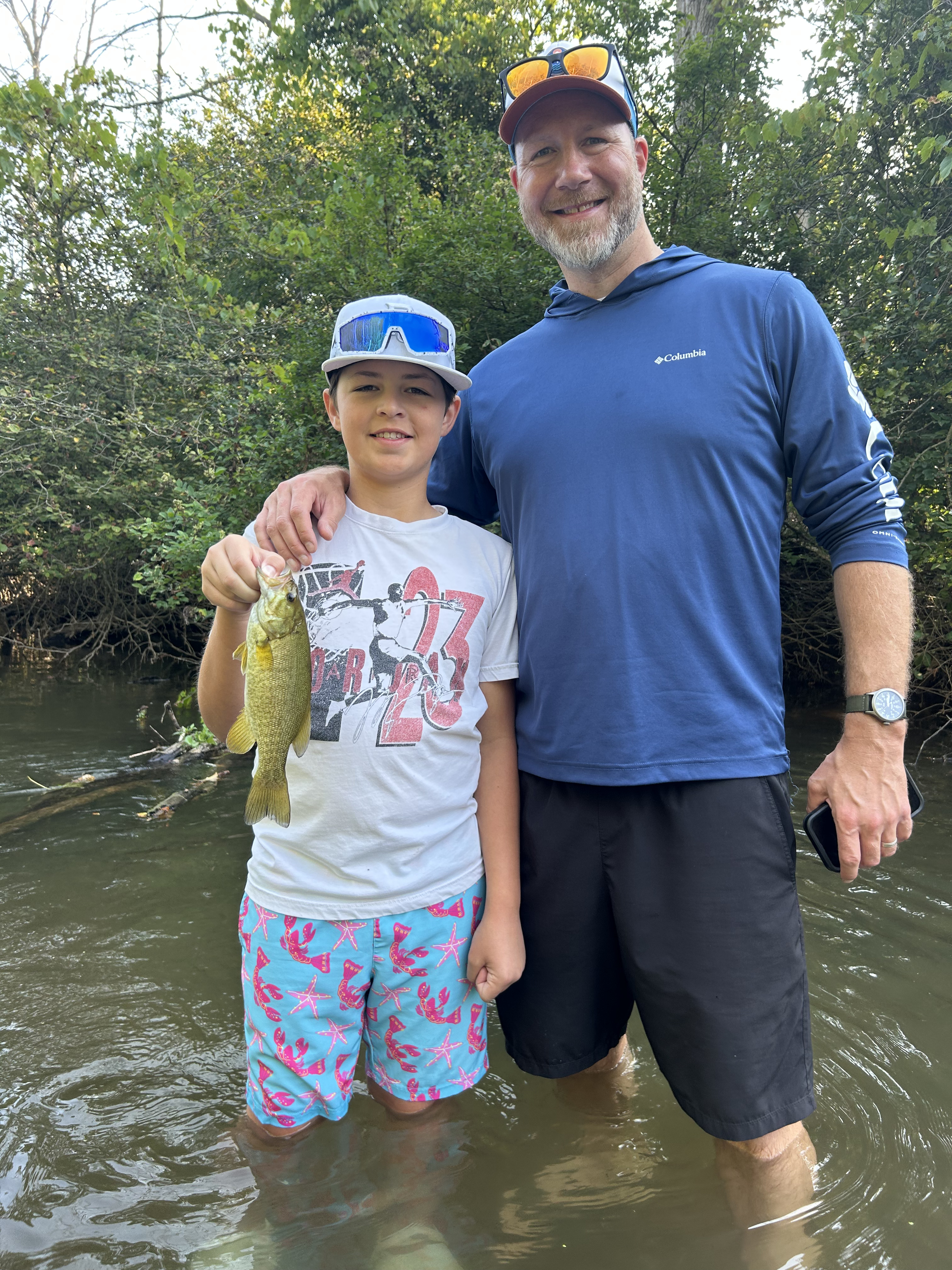 Jared Jones guiding men fishing on Rochester NY waterways Wayfound Outdoors