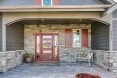 gray stamped front concrete patio