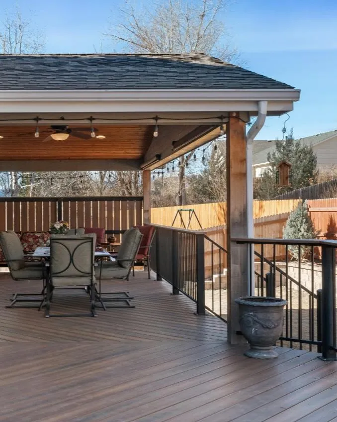 a kitchen with a sink and a lot of clutter on the counter