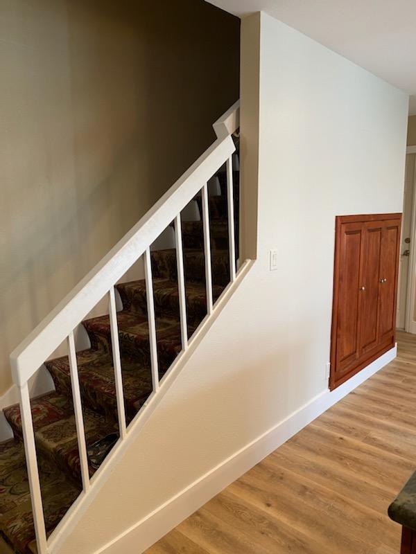Exterior house repainted with blue siding and white trim