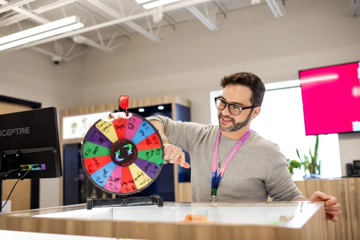 Community members chatting in a bright Chelsea neighborhood lounge.