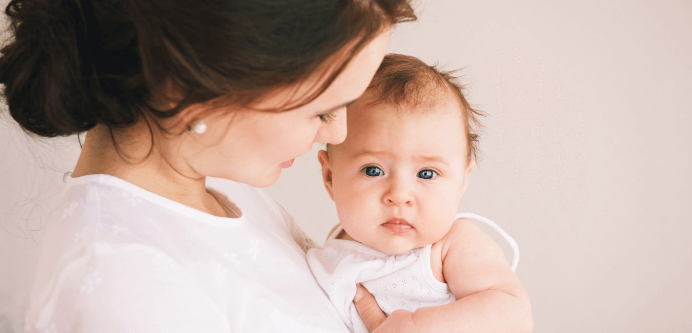 A mother holding her baby
