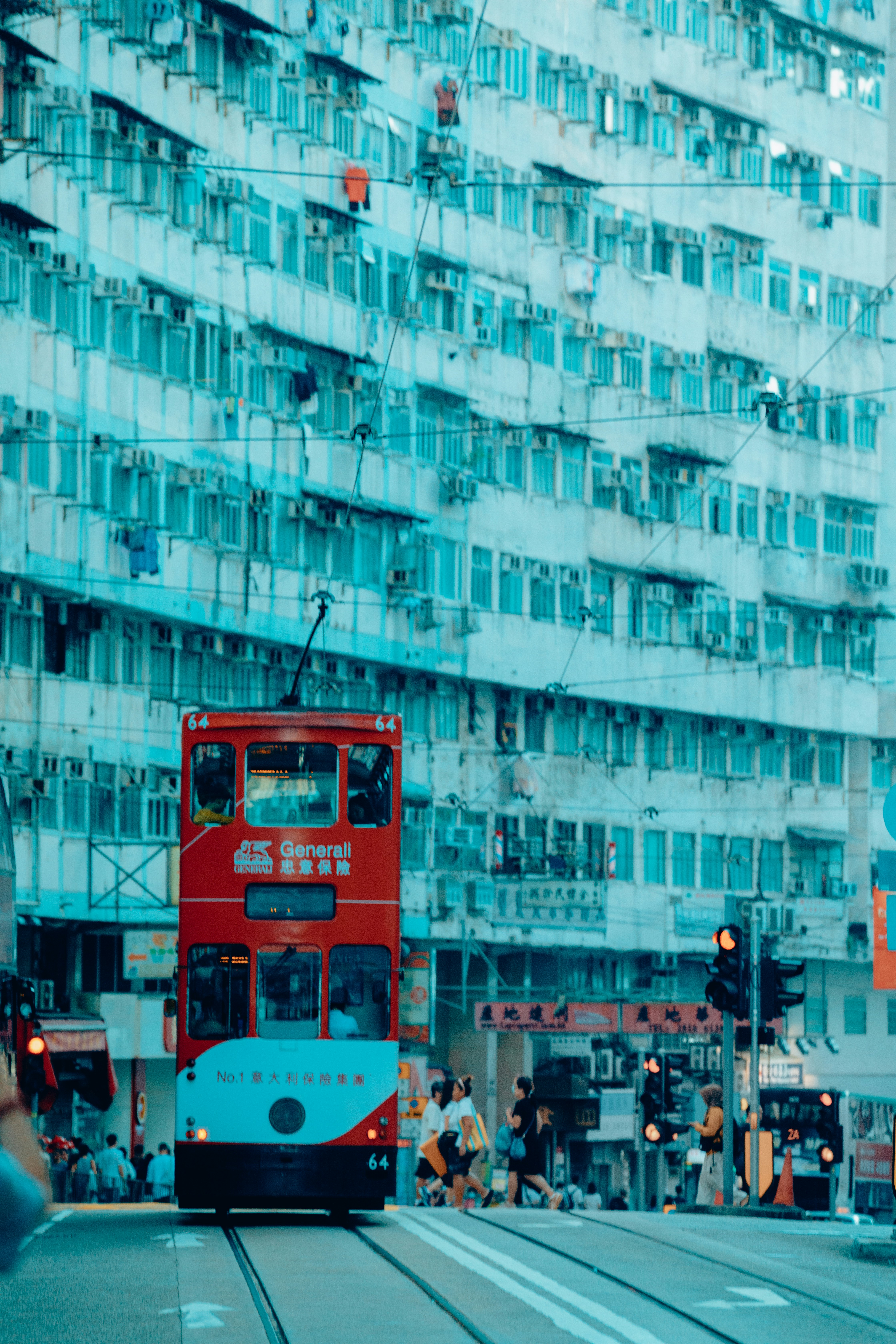Hong Kong red tram, with aqua buildings in the background