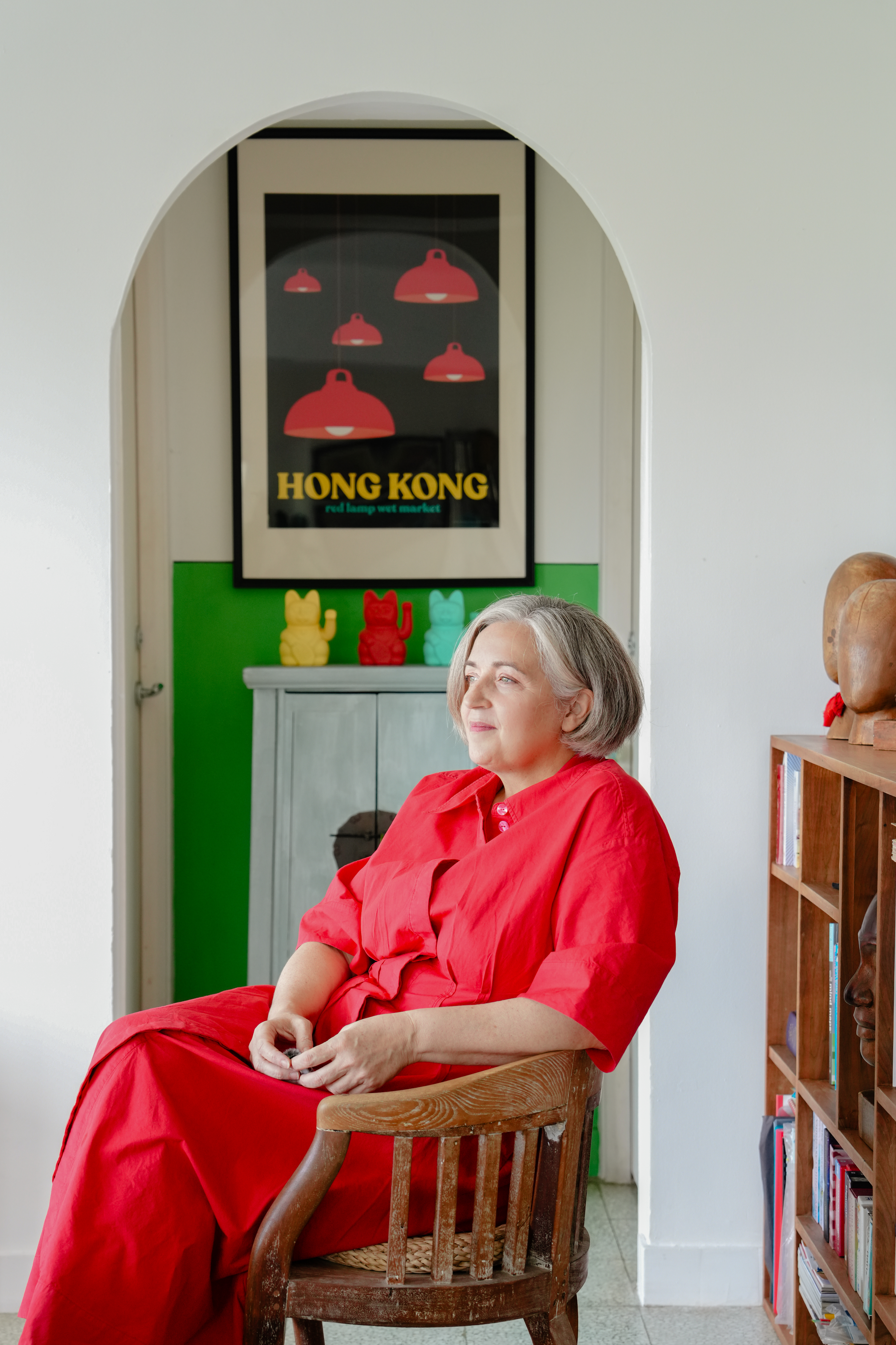 Picture of Josianne Robb in a red dress, in her home in Hong Kong