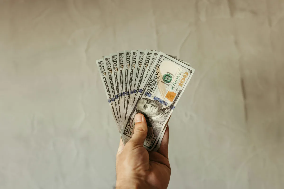 A yellow bus parked in front of a building