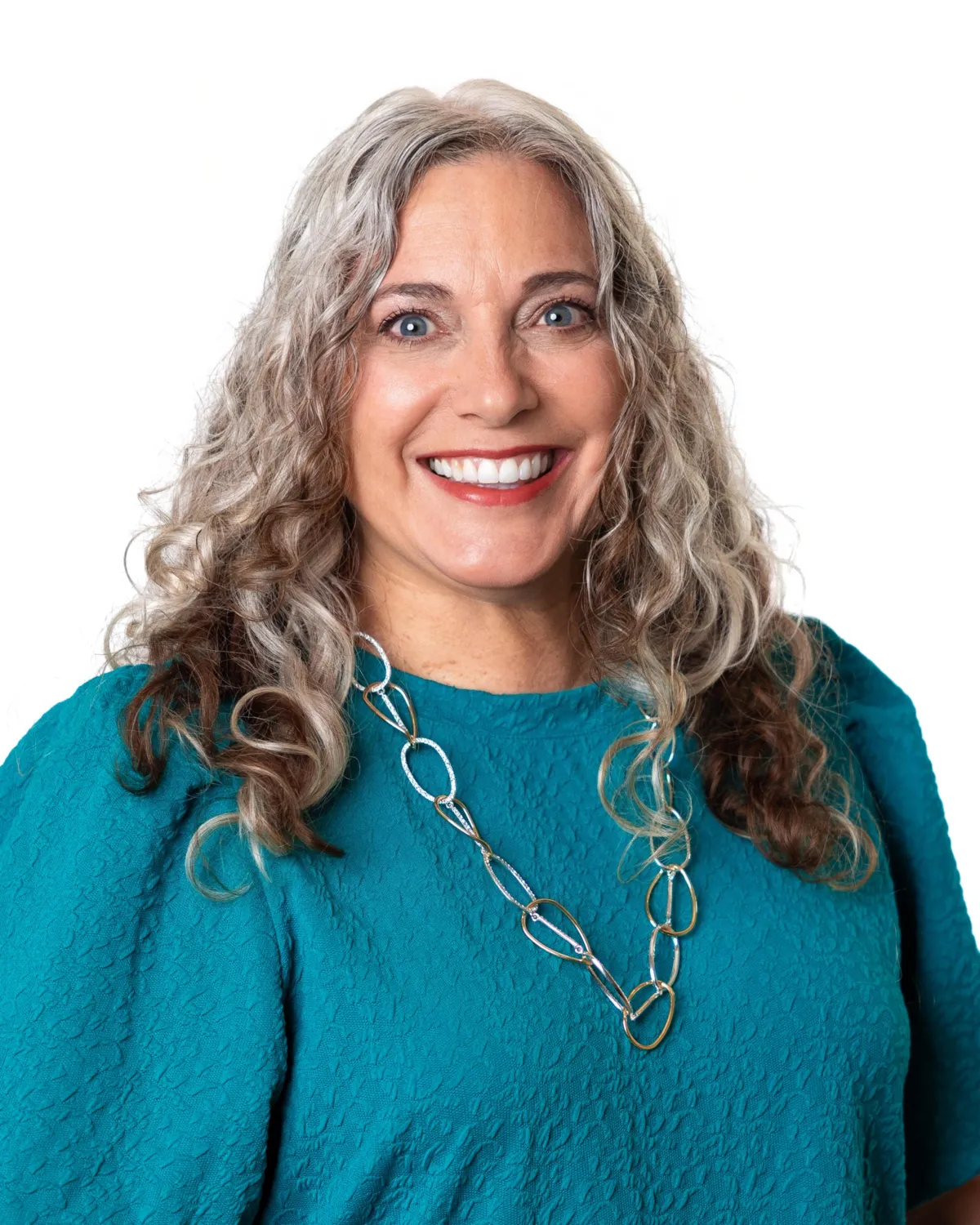 A yellow bus parked in front of a building