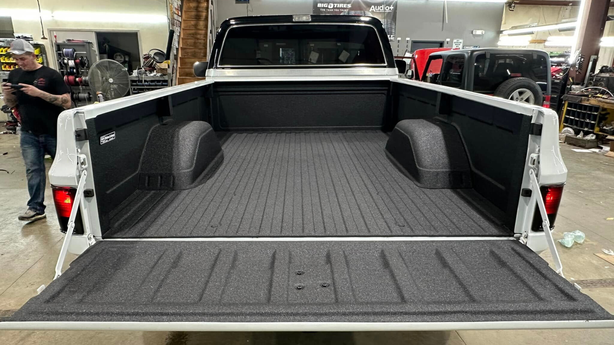Truck bed with black spray-in bedliner coating