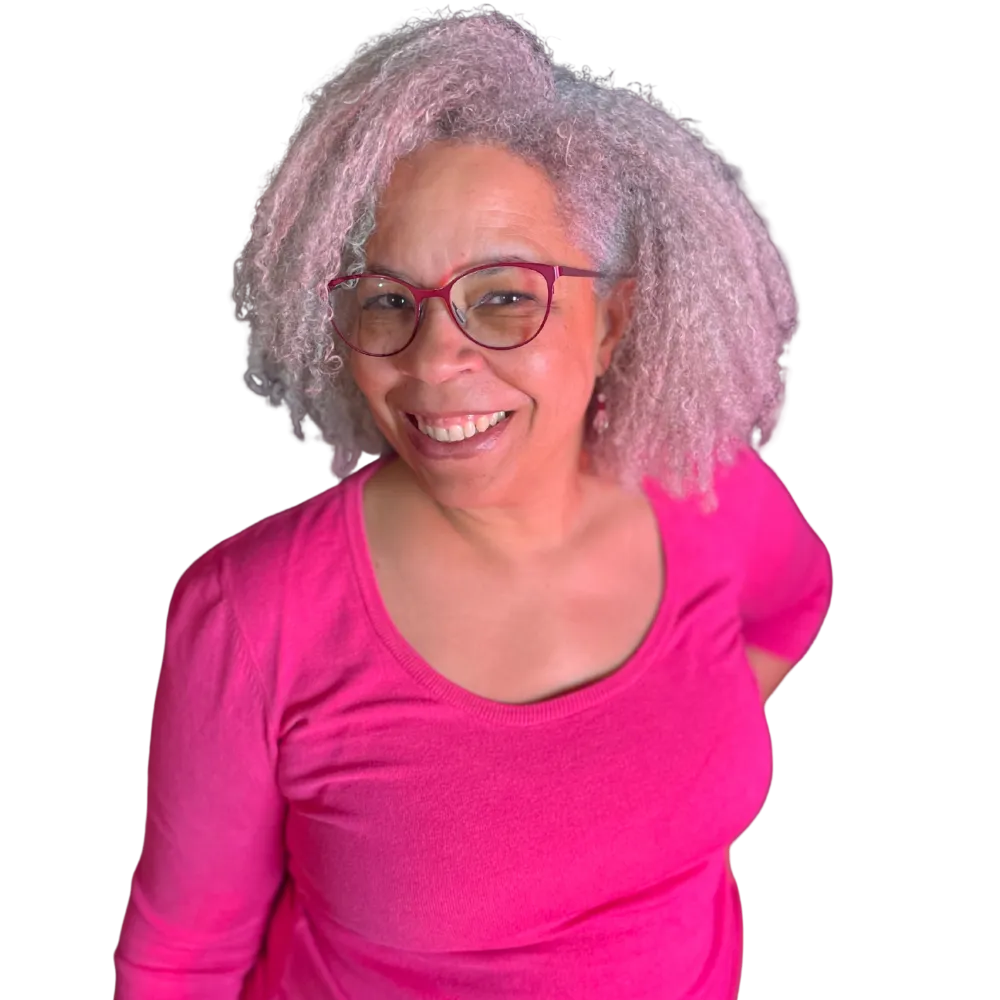 Tanya Spencer standing with one hand on her hip and radiating warmth and competence as a leadership communication coach. 