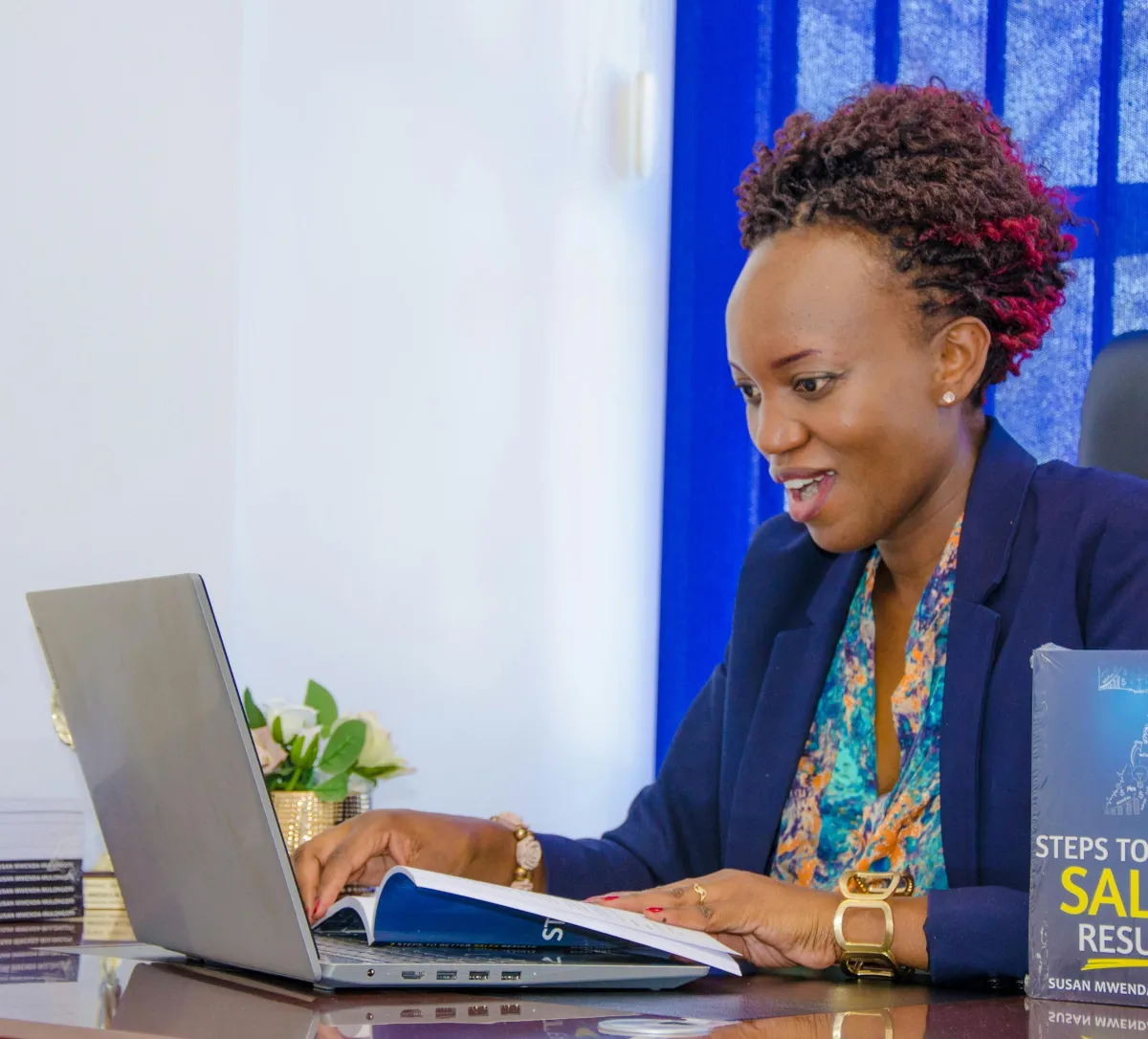 Simplify Your Tech - happy woman working on a laptop