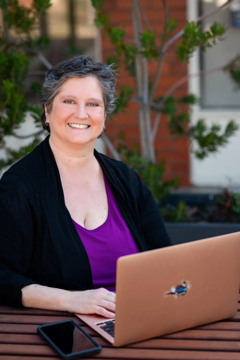 Simplify Your Tech - two women on laptops one stressed one calm