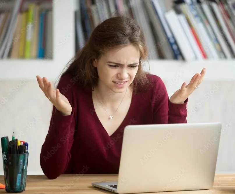 Simplify Your Tech woman confused at laptop