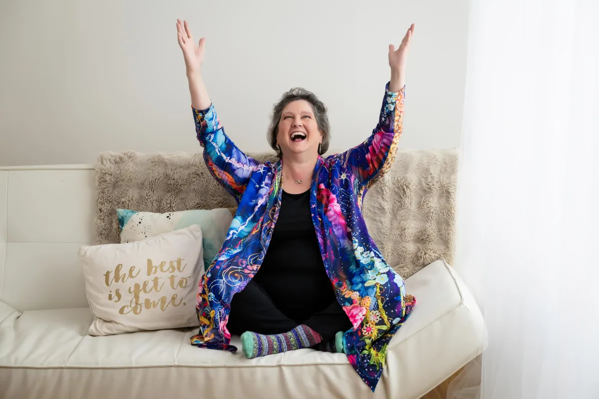 Kat Milner the tech ninja raising hands in celebration