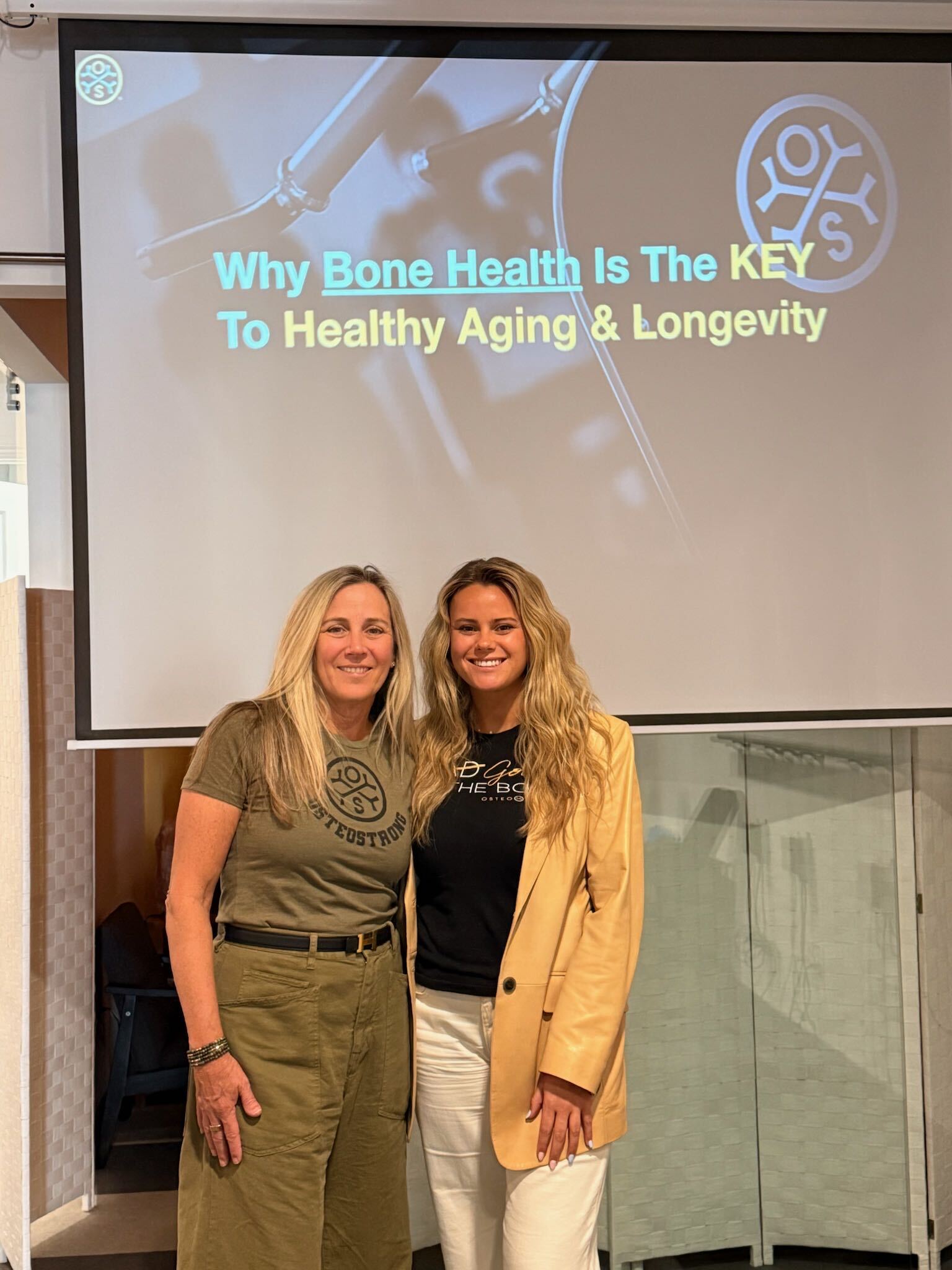 Mackenzie and Amy McMahon hosting a bone health education seminar at the center