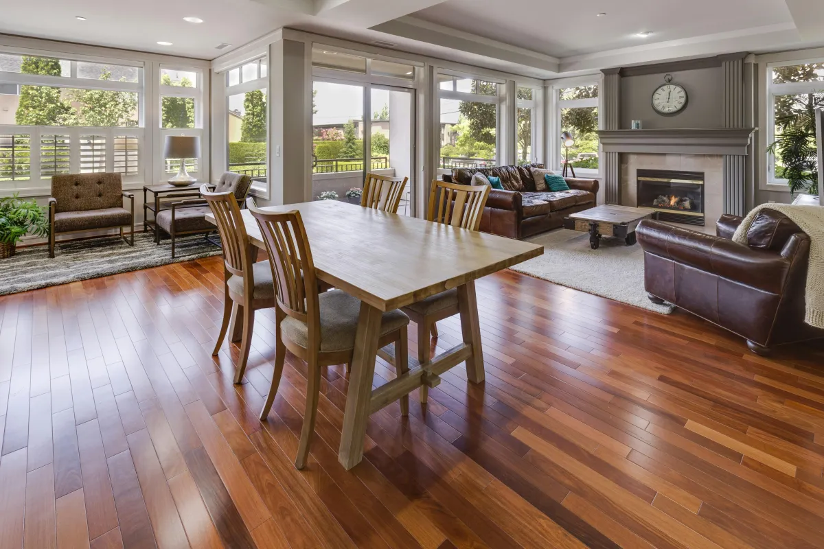 Professional hardwood flooring installation in renovated home.