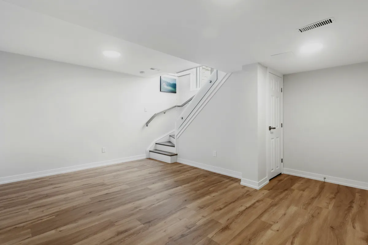 Finished basement renovation with modern living area.