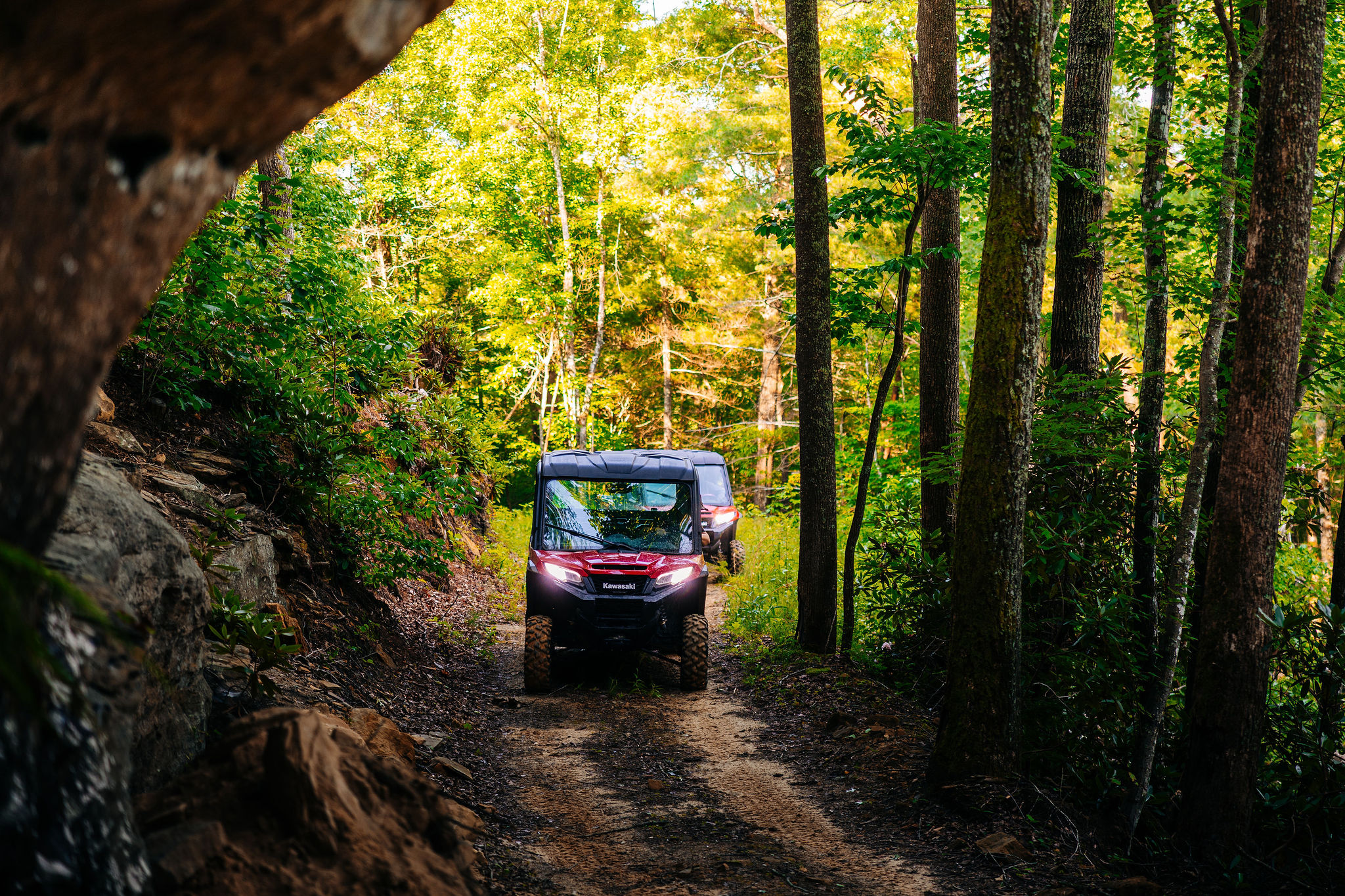 Guide leading a second side-by-side down a private Red River Gorge trail