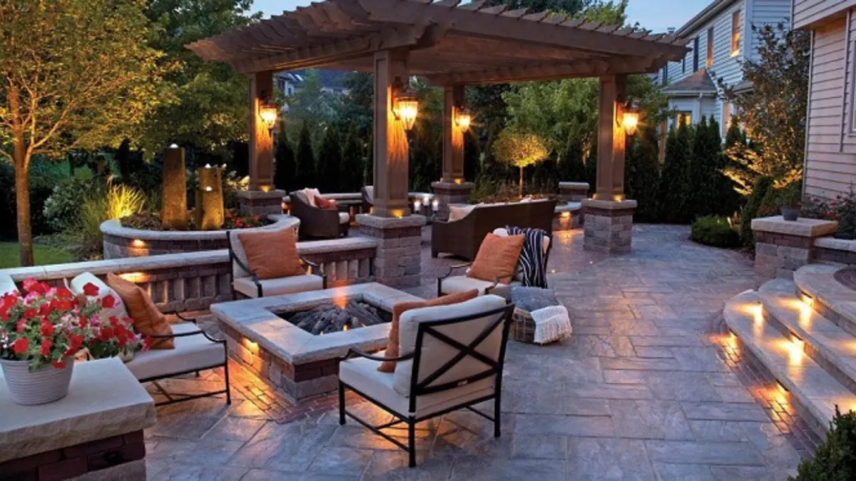 Beautifully designed outdoor fire pit by Hardscape Denver on a paved patio