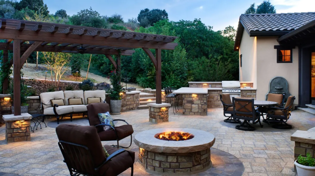 Beautifully designed outdoor fire pit by Hardscape Denver on a paved patio