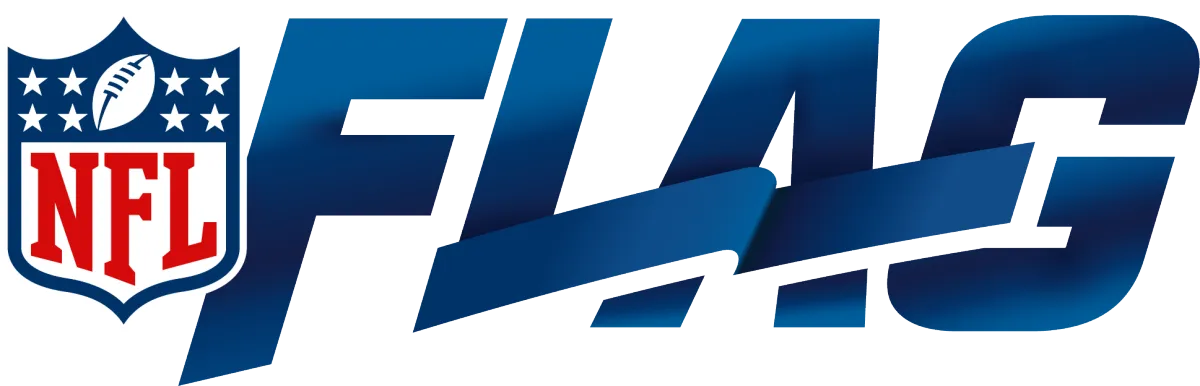 Man standing on wall near dark car at sunset